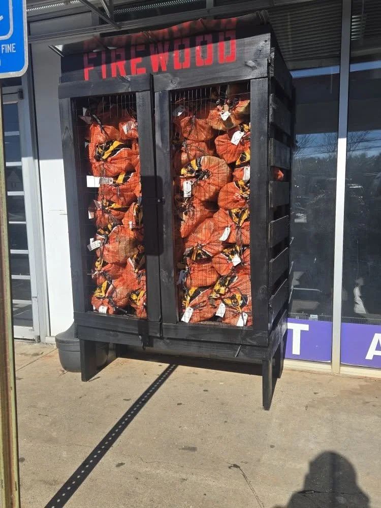 Bagged firewood rack outside a Georgia storefront
